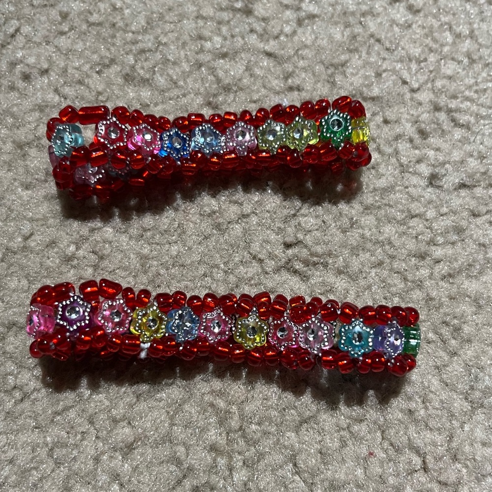 Two bracelets| alternating multicolored star gems inside & red bead embroidery